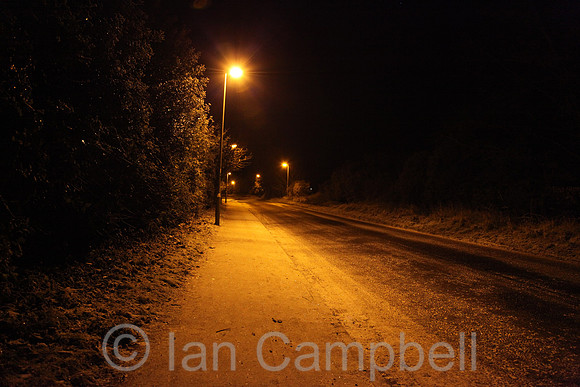 Faringdon street, lit by street lights on a cold winter's evening